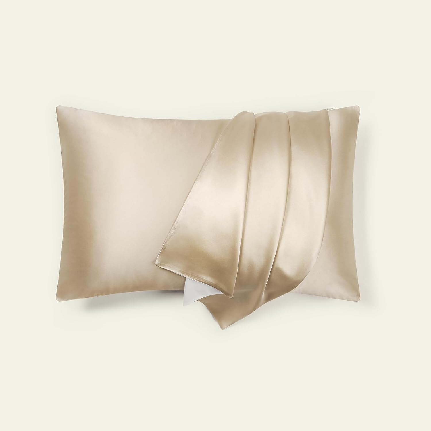 Silk pillowcase with matching sheets, promoting a luxurious bedding set for comfortable sleep. Suitable for a shopping article