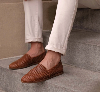 person wearing brown loafers