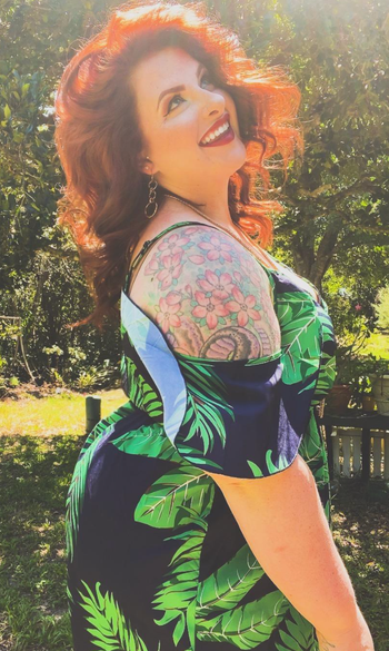 Reviewer showing side angle of the cold shoulder sleeve 