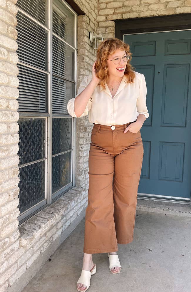 A model posing in the taupe pants