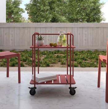 The cart in persimmon with plants and decor
