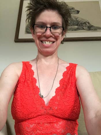 reviewer in red lace bralette