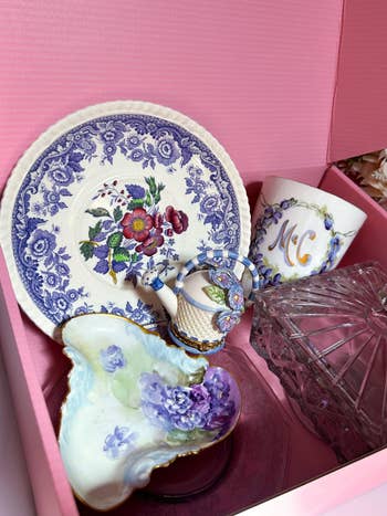 Assorted floral china, monogrammed cup, and crystal point successful a pinkish box, arranged for buying oregon acquisition presentation