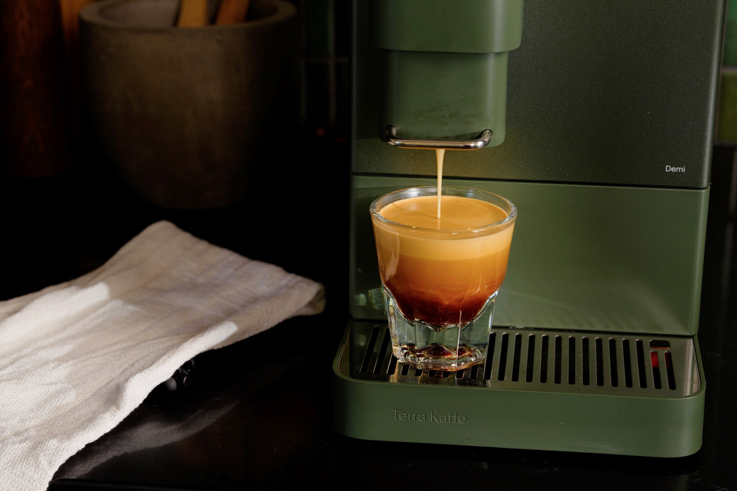 closeup of espresso instrumentality   pouring espresso into a cup