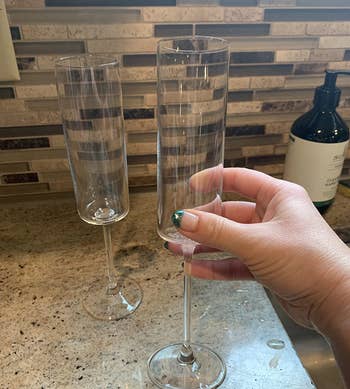 Reviewer holding one of the glasses