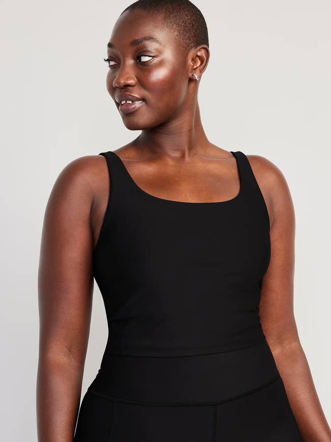 Model successful  a sleek sleeveless apical  looks to the side, suitable for fittingness  oregon  casual wear
