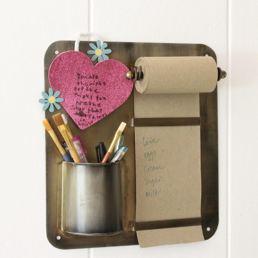 The brass plate with paper note roll and pen cup