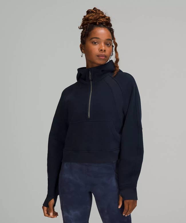 model wearing the sweatshirt in navy blue