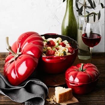 red tomato cocotte full of pasta
