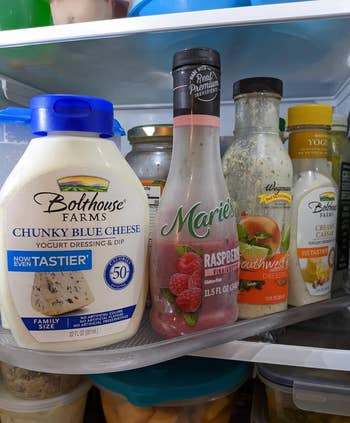 Condiments propped on a definite plastic turning tray keep in in a fridge 