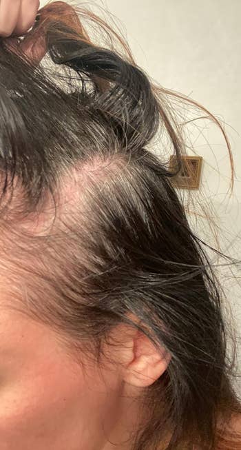 Reviewer showing hair before using root cover-up spray with greys showing