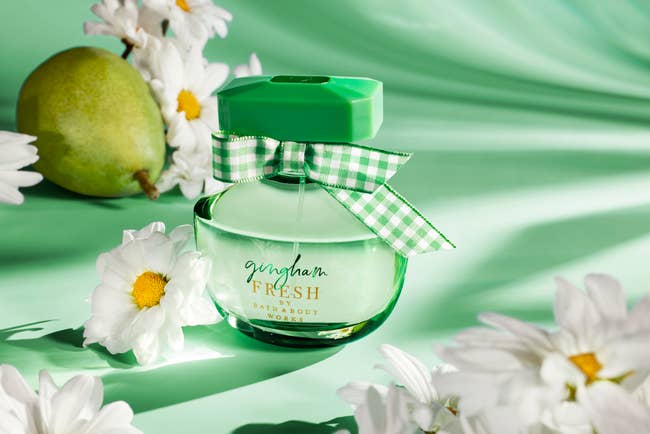 the green bottle of perfume