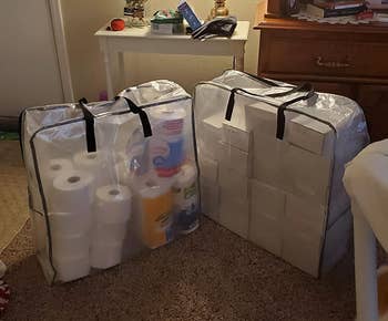 a reviewer's two large square bags holding household supplies