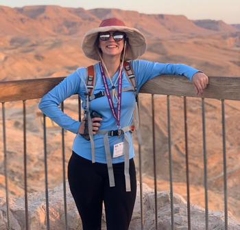 reviewer in blue long sleeve UPF 50+ shirt and leggings on outdoor hike