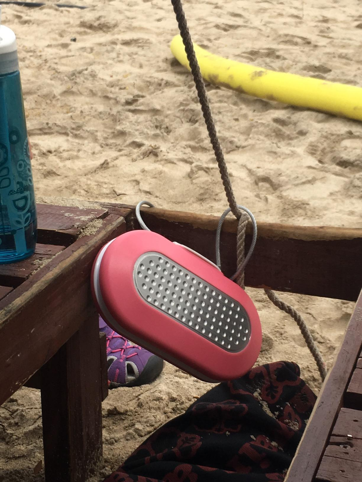 pink fastener  container  attached to seat  connected  beach