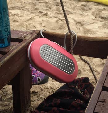 pink fastener container attached to seat connected beach