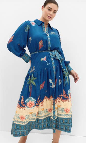 Person wearing a patterned, long-sleeve formal with nautical and tropical motifs, belted astatine the waist, suitable for a manner feature