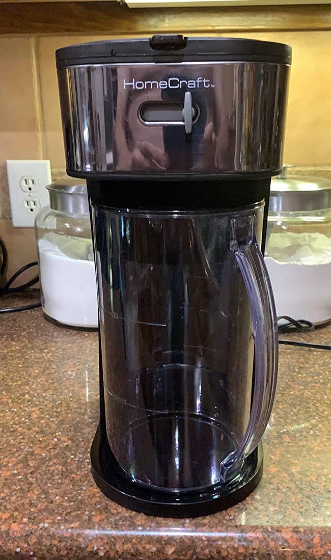 Reviewer image of black iced coffee maker with plastic empty pitcher underneath