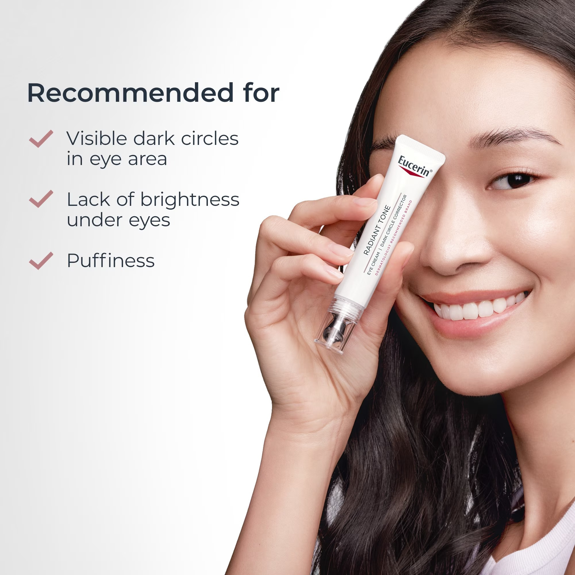 Smiling idiosyncratic   holding Eucerin merchandise  adjacent   eye; recommended for acheronian  circles, deficiency  of brightness, puffiness reduction