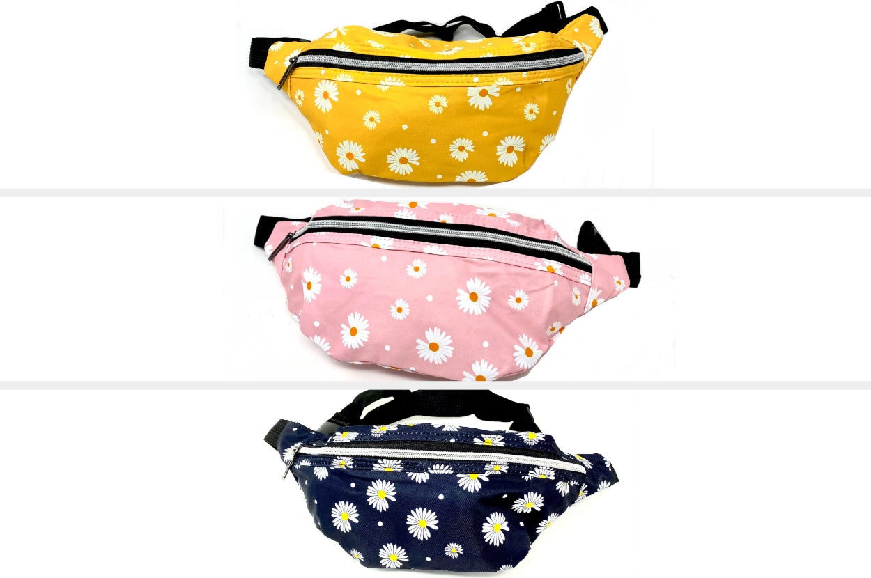 Top to bottom: yellow, pink, and navy blue fanny packs with black straps and white daisies on a white background
