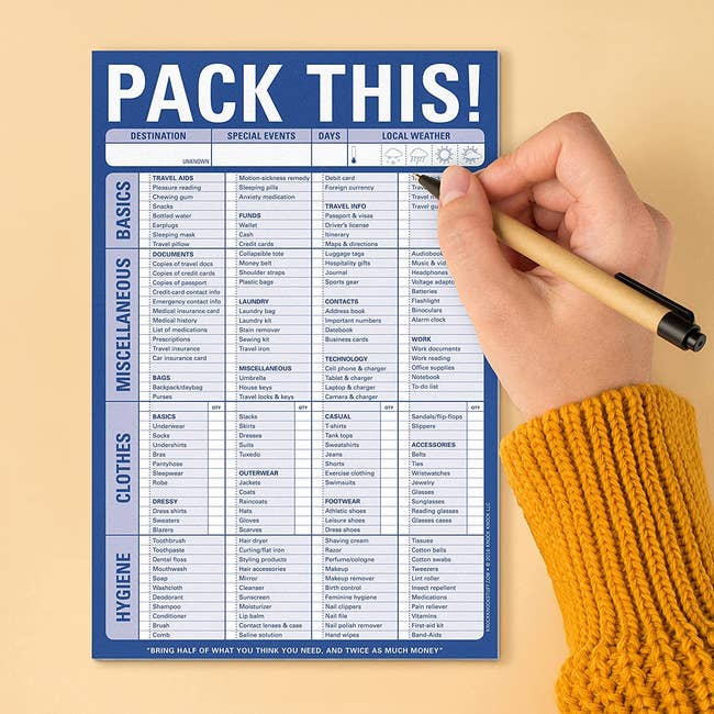 a model using a pen with the packing list