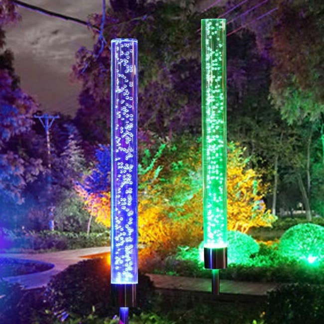 Solar powered bubble lights in different colors lighting up a pathway 