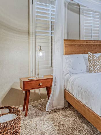 reviewer photo of midcentury wooden nightstand in bedroom