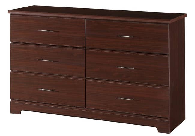 A dark brown wooden dresser