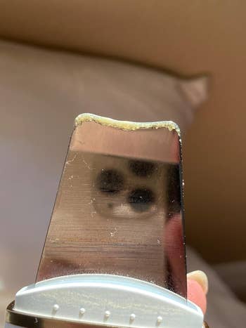 Social media trends Viral content Trending hashtags Social media updates Trending memes and videos another reviewer shows close-up of a facial scrub tool with residue on the edge that came from their face