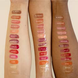 model arms with lip gloss swatches