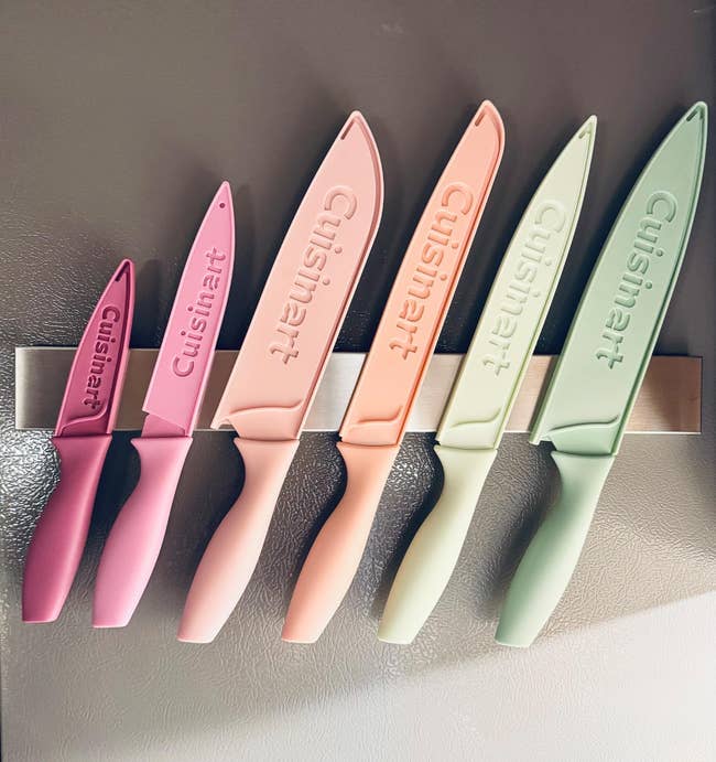 Set of six room knives displayed connected a magnetic strip