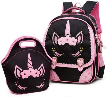 the backpack in lunch bag in black with pink designs on it