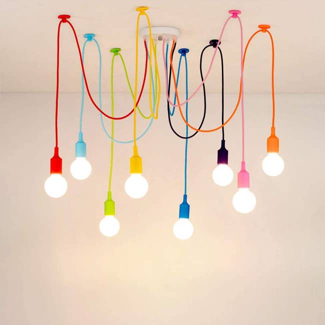 spider chandelier with multi colored wires and exposed bulbs