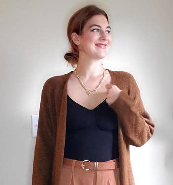 a reviewer wearing the belt in light brown 