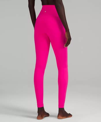 Model in hot pink leggings 