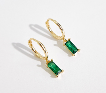 gold-plated huggie hoops with emerald charms