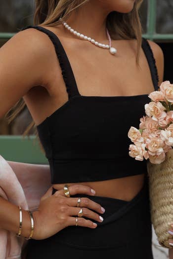 a model posing in the black bra