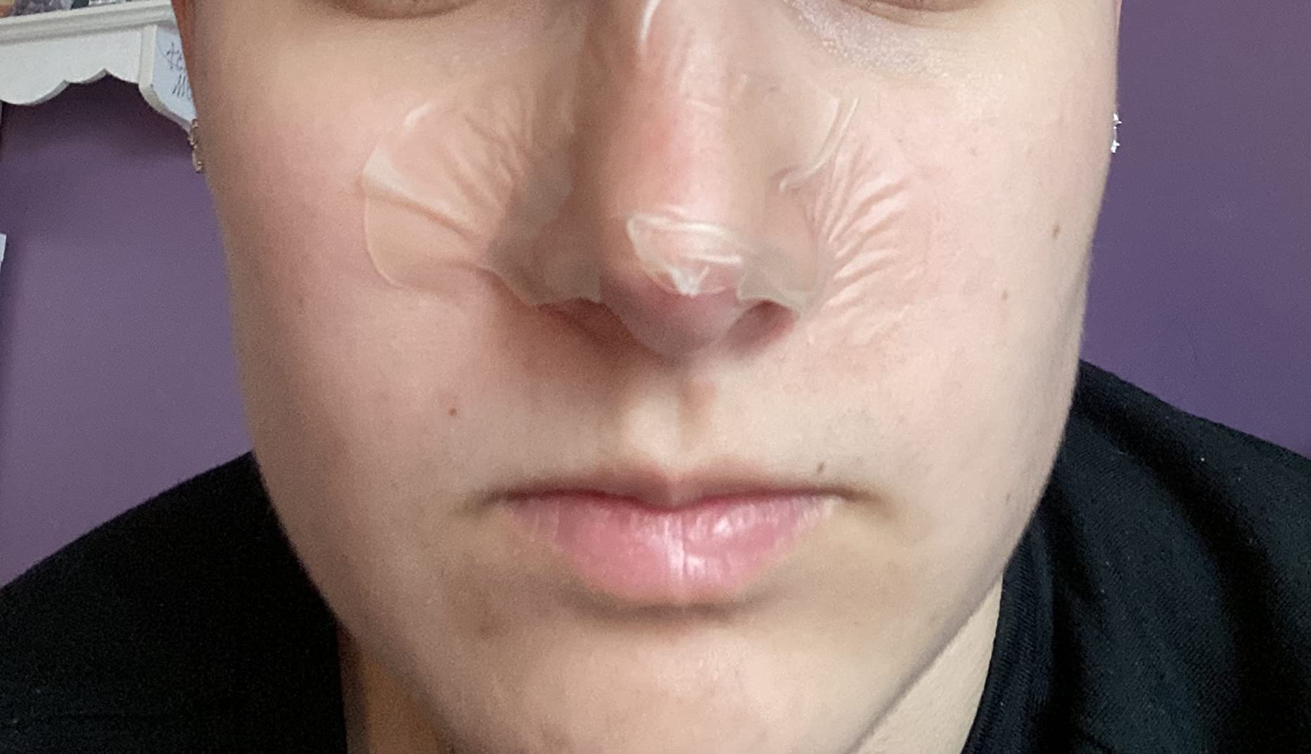 Person with a chemoreceptor  portion   on, perchance  for skincare. The representation  focuses connected  their face, highlighting the skincare merchandise  successful  use