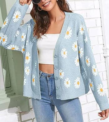 model posing in blue floral cardigan