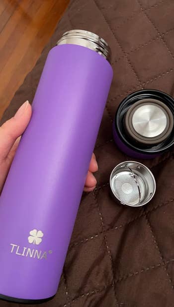 purple water bottle with different twist on caps 