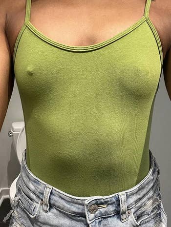 reviewer wearing a choky  vessel  apical  and a Nippie connected  1  bosom  but not the other