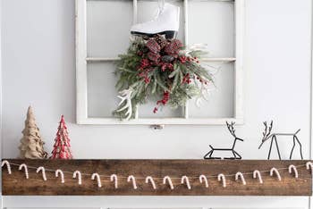 candy cane garland hanging over a mantle