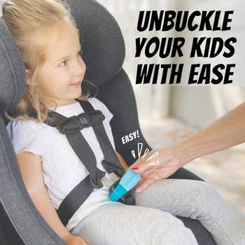 Device shown facilitating the unbuckling of a child's car seat