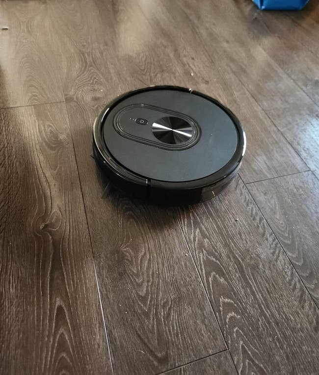 reviewer image of the vacuum on hardwood floor