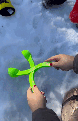 a gif of a reviewer using a tool to mold a perfect snowball