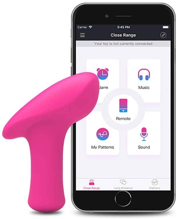 Pink hammer-shaped bullet vibrator next to cell phone