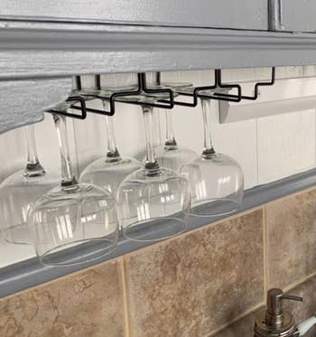 another reviewer's black wine glass rack under kitchen cabinets