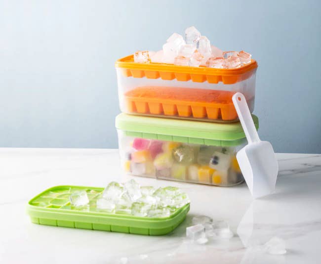 clear ice cube containers with scoop and silicone trays filled with ice