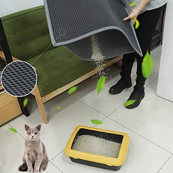picture of same mat getting emptied out above a litter box: it has a slot that opens to let all the trapped litter out