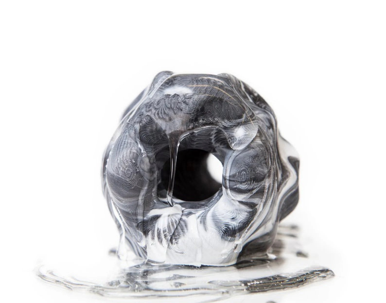 Gray and white marble stroker with lubricant
